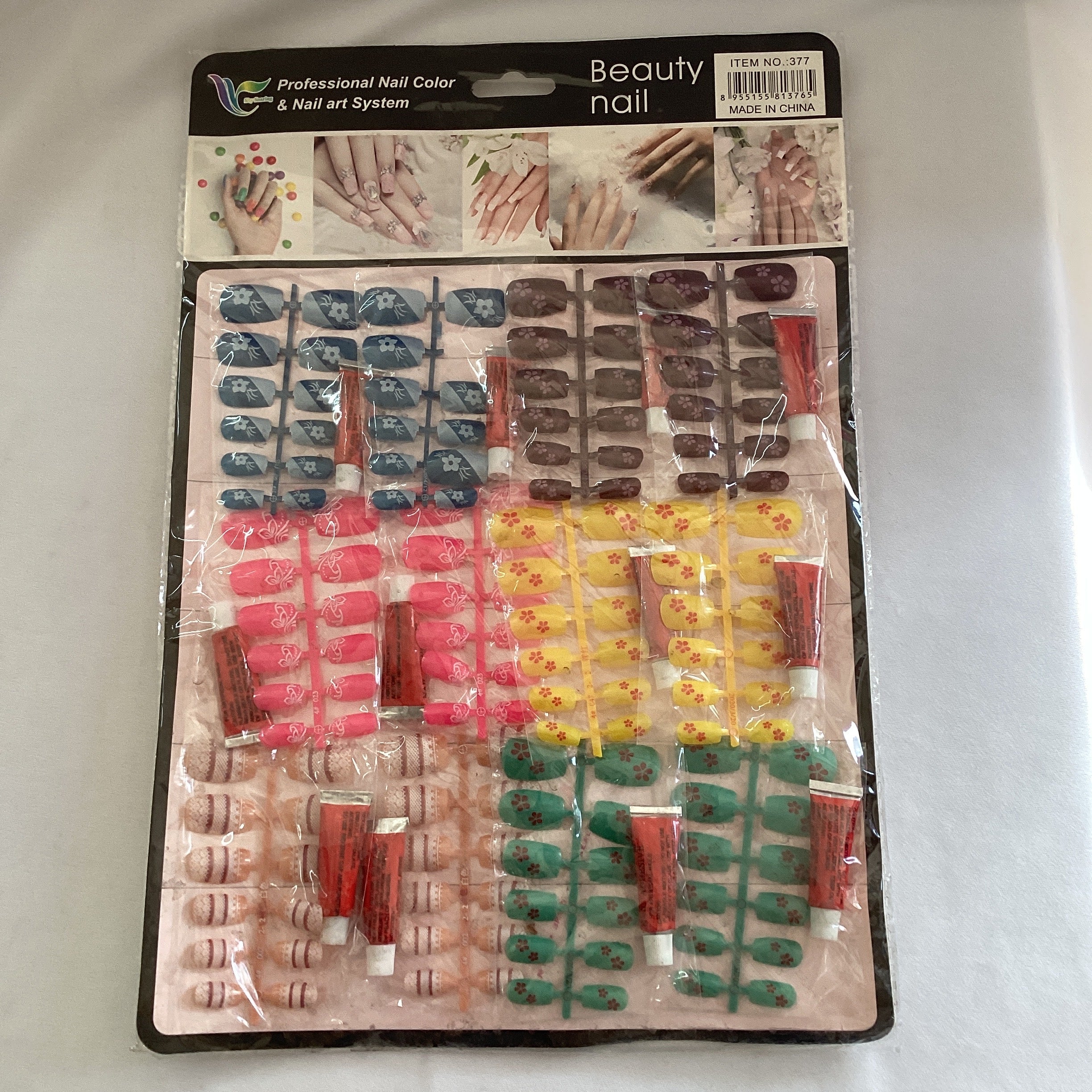 UÑAS ECONÓMICAS EN BLISTER CON PEGAMENTO SURTIDA EN DISEÑOS Y COLORES POR MAYOREO
