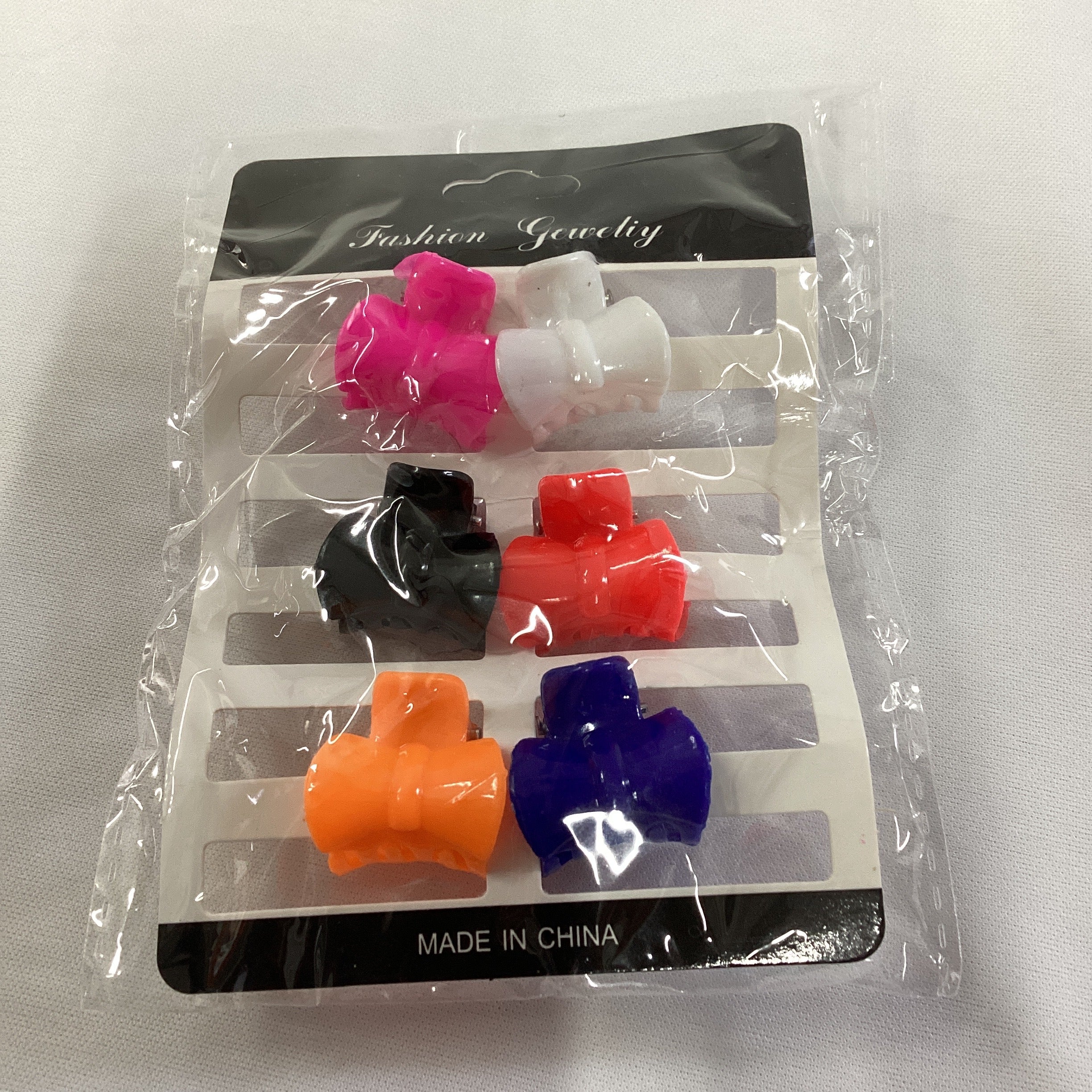 SET DE PINZAS MINI CON 6 PZAS DE 2 CM SURTIDAS EN COLORES POR MAYOREO
