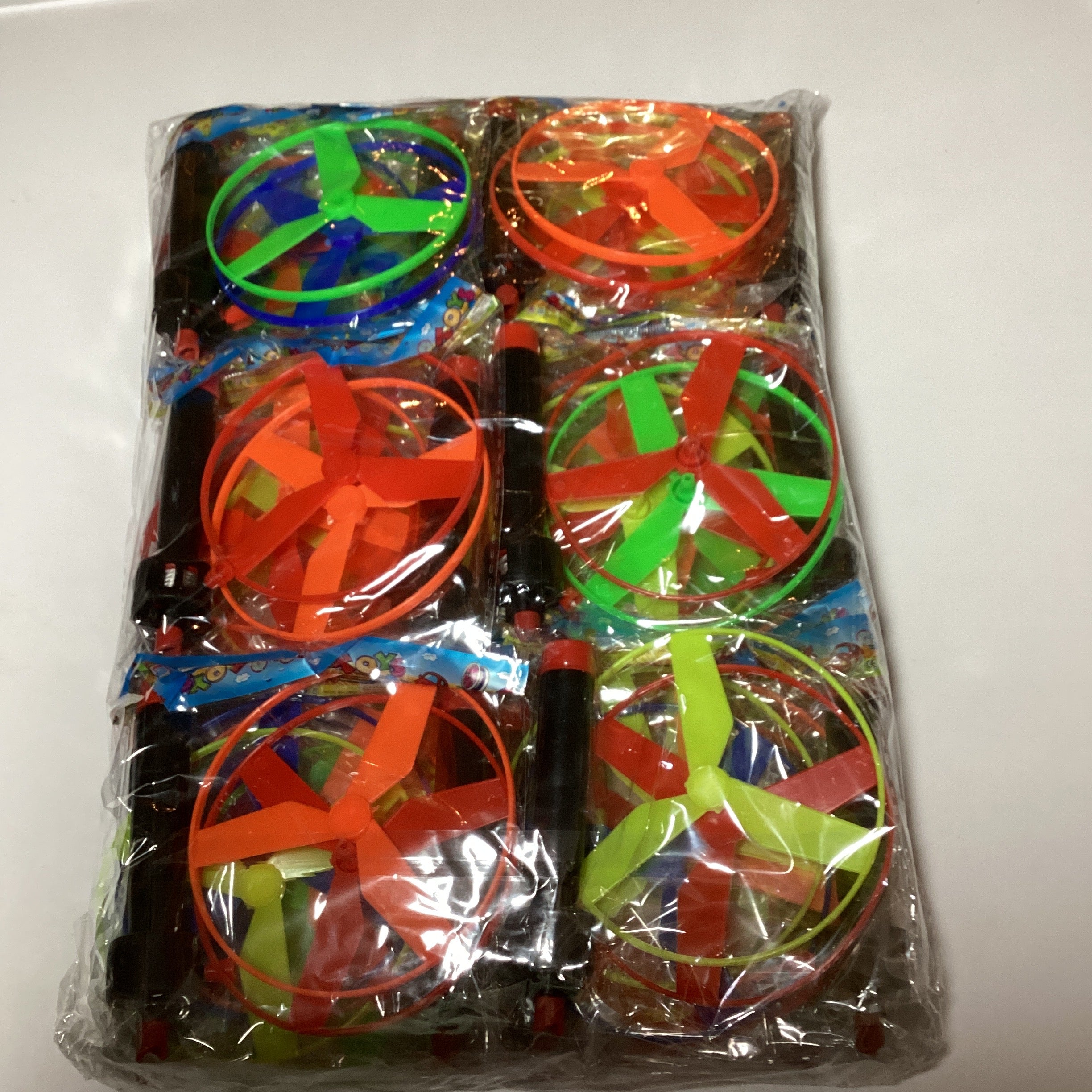 JUGUETE HÉLICE VOLADORA 10 CM. DIÁMETRO SURTIDA EN COLORES POR MAYOREO