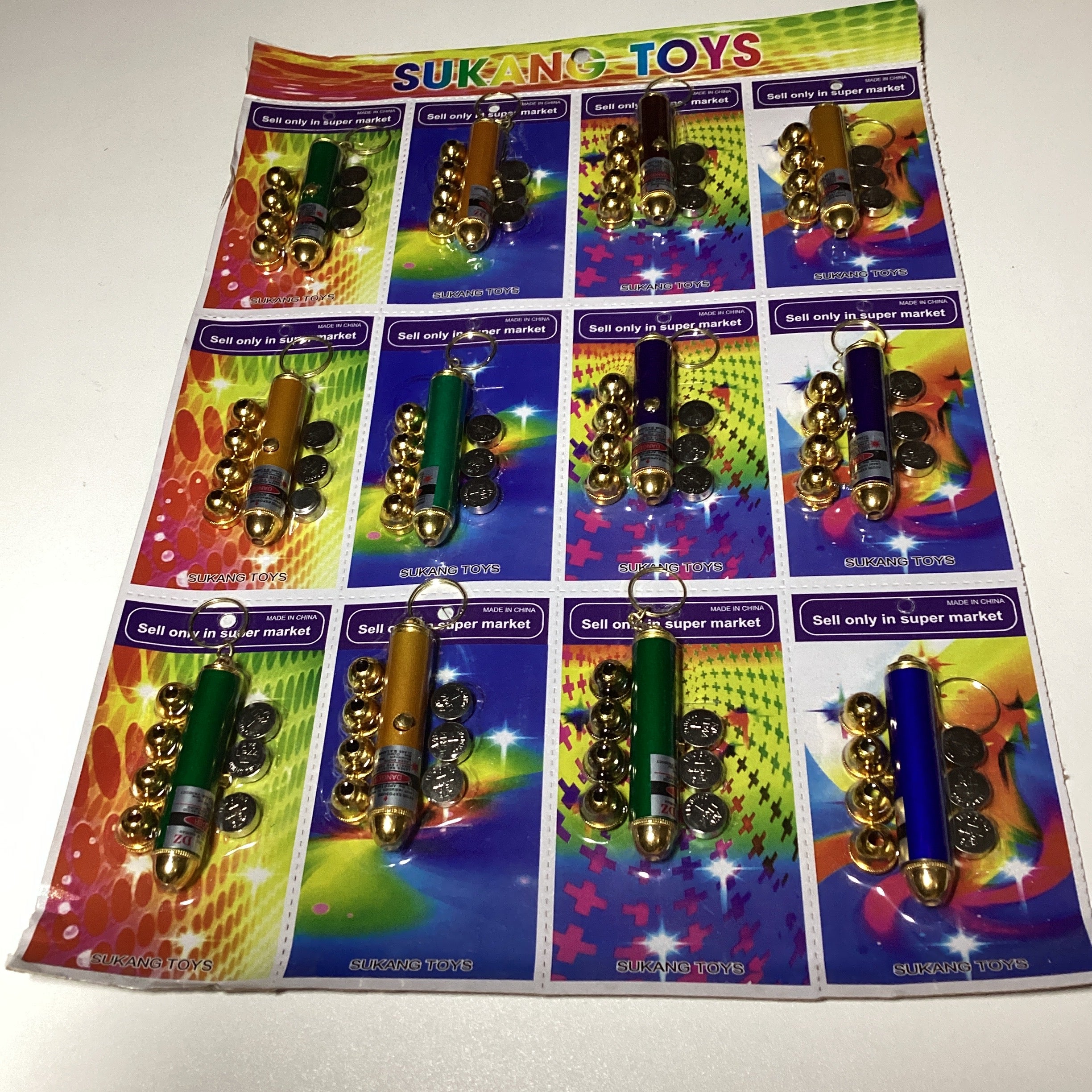 LASER 7 CM CON 4 PUNTAS Y SUS PILAS SURTIDO EN COLORES POR MAYOREO