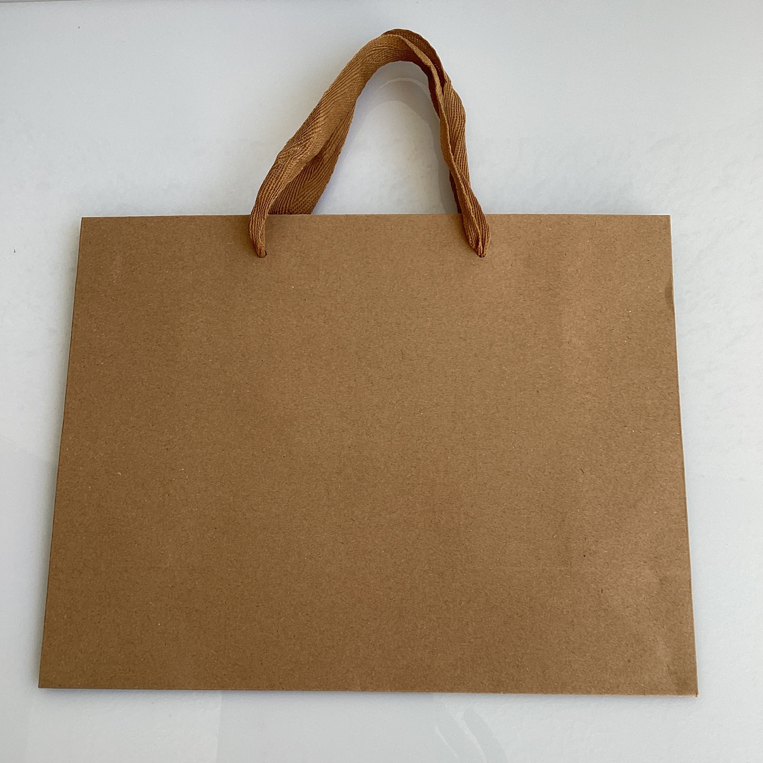 BOLSA DE PAPEL KRAFT 27X21 CM CAFE POR MAYOREO