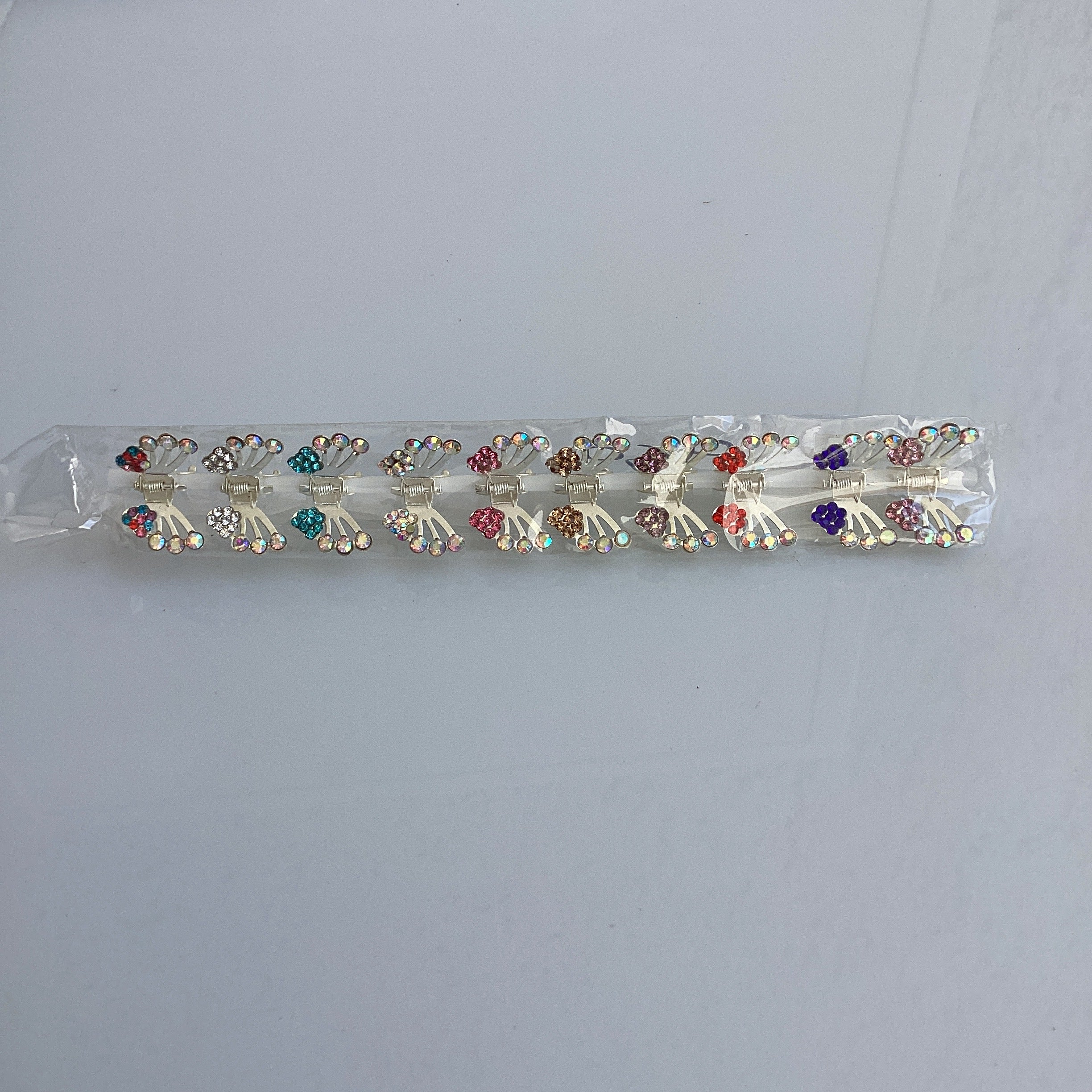 PINZA MINI METÁLICA DECORADA MARIPOSAS SURTIDA EN COLORES POR MAYOREO