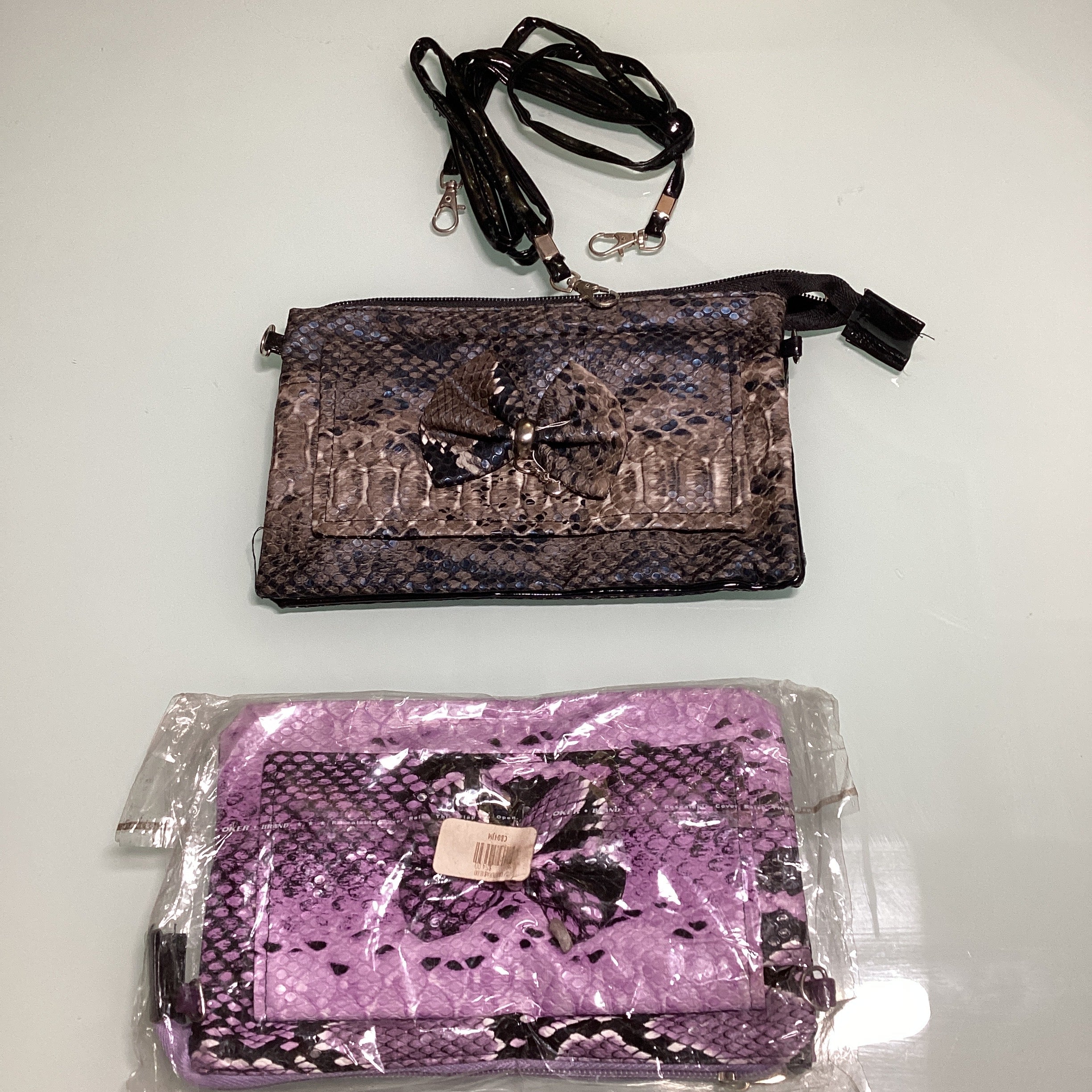 BOLSA MONEDERO MOTIVOS ANIMAL PRINT 19X12 CM SURTIDO EN COLORES POR MAYOREO