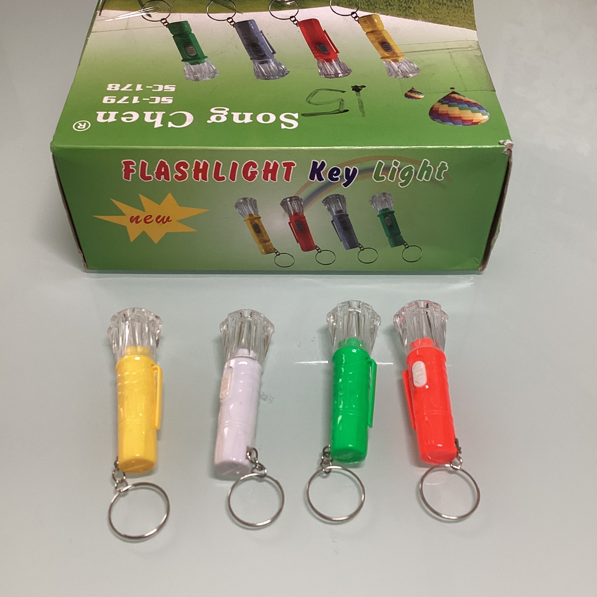 LÁMPARA PORTATIL TIPO LLAVERO 7 CM SURTIDA EN COLORES POR MAYOREO