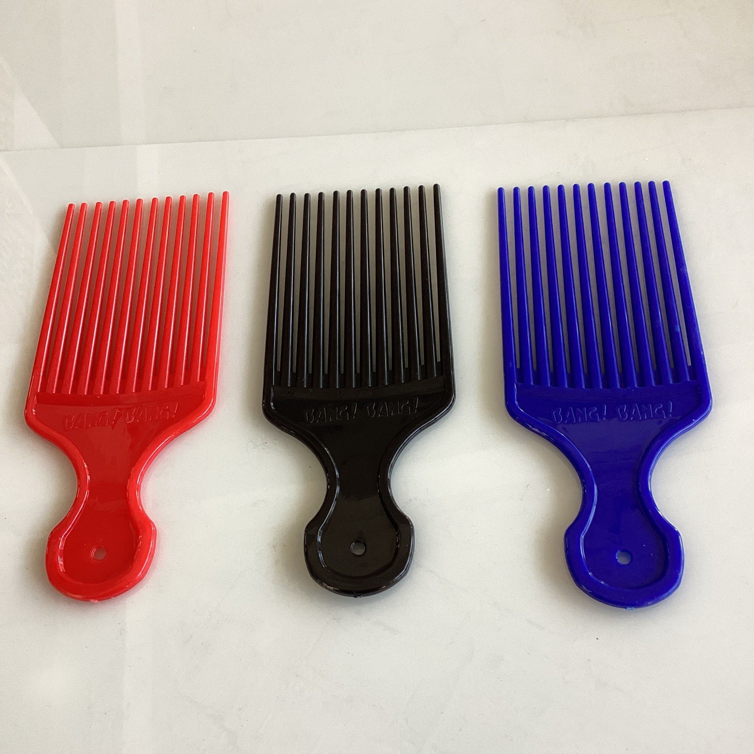 PEINE PARA DESENREDAR 18 CM ROJO Y AZUL POR MAYOREO
