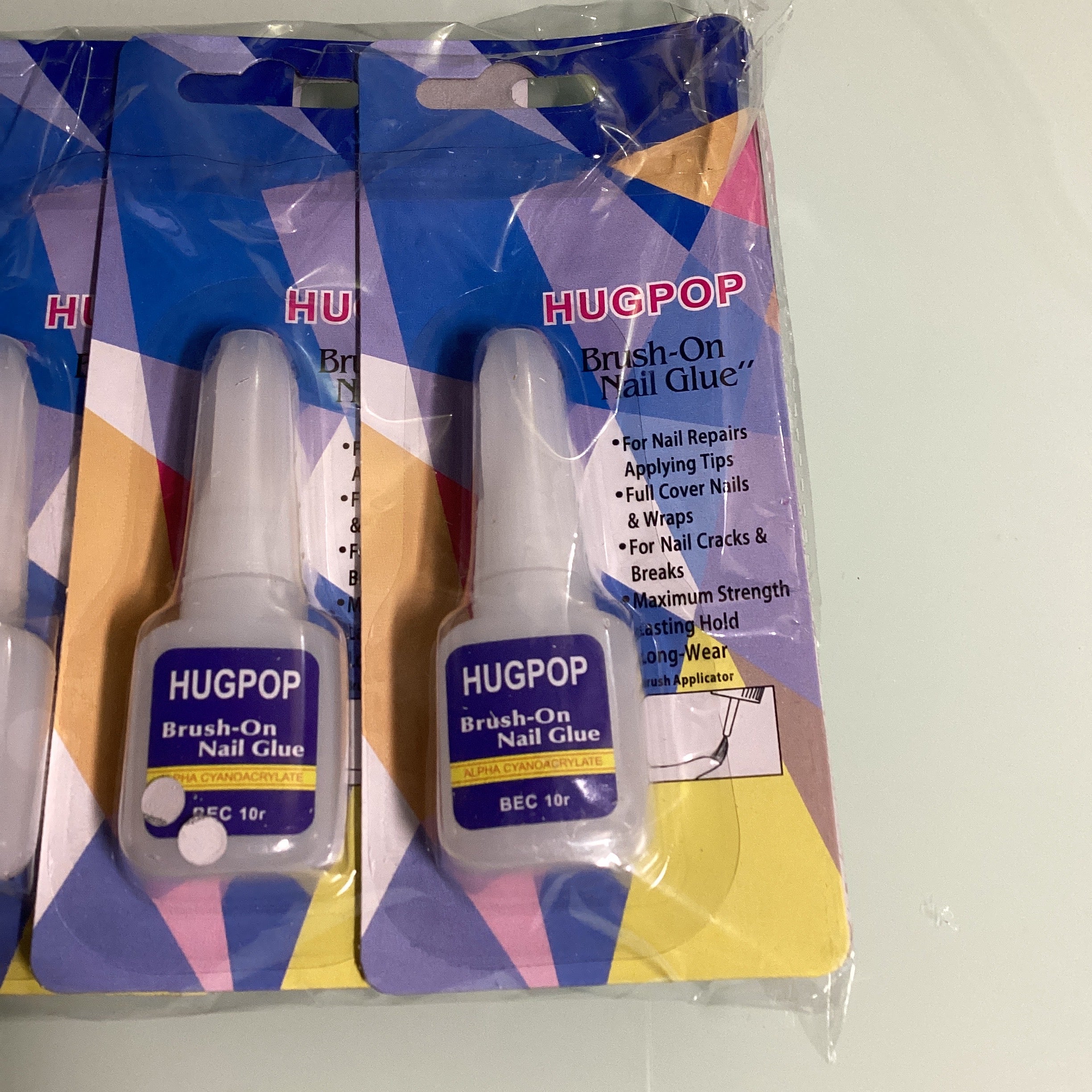 PEGAMENTO PARA UÑAS HUGPOP 10 GR. EN ESTUCHE INDIVIDUAL  CON BORCHITA APLICADORA POR MAYOREO