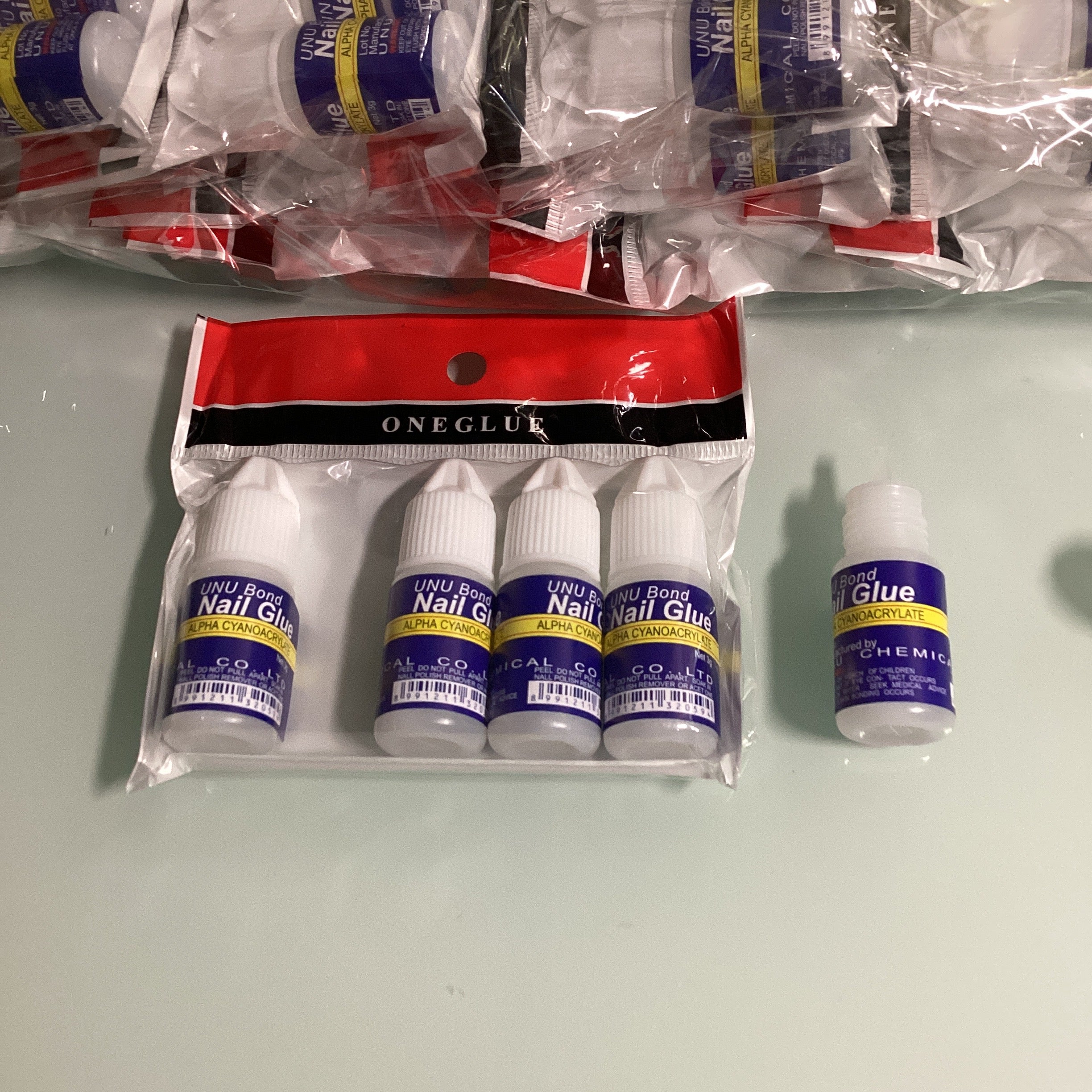 PEGAMENTO PARA UÑAS 3GRS. ETIQUETA AZUL POR MAYOREO