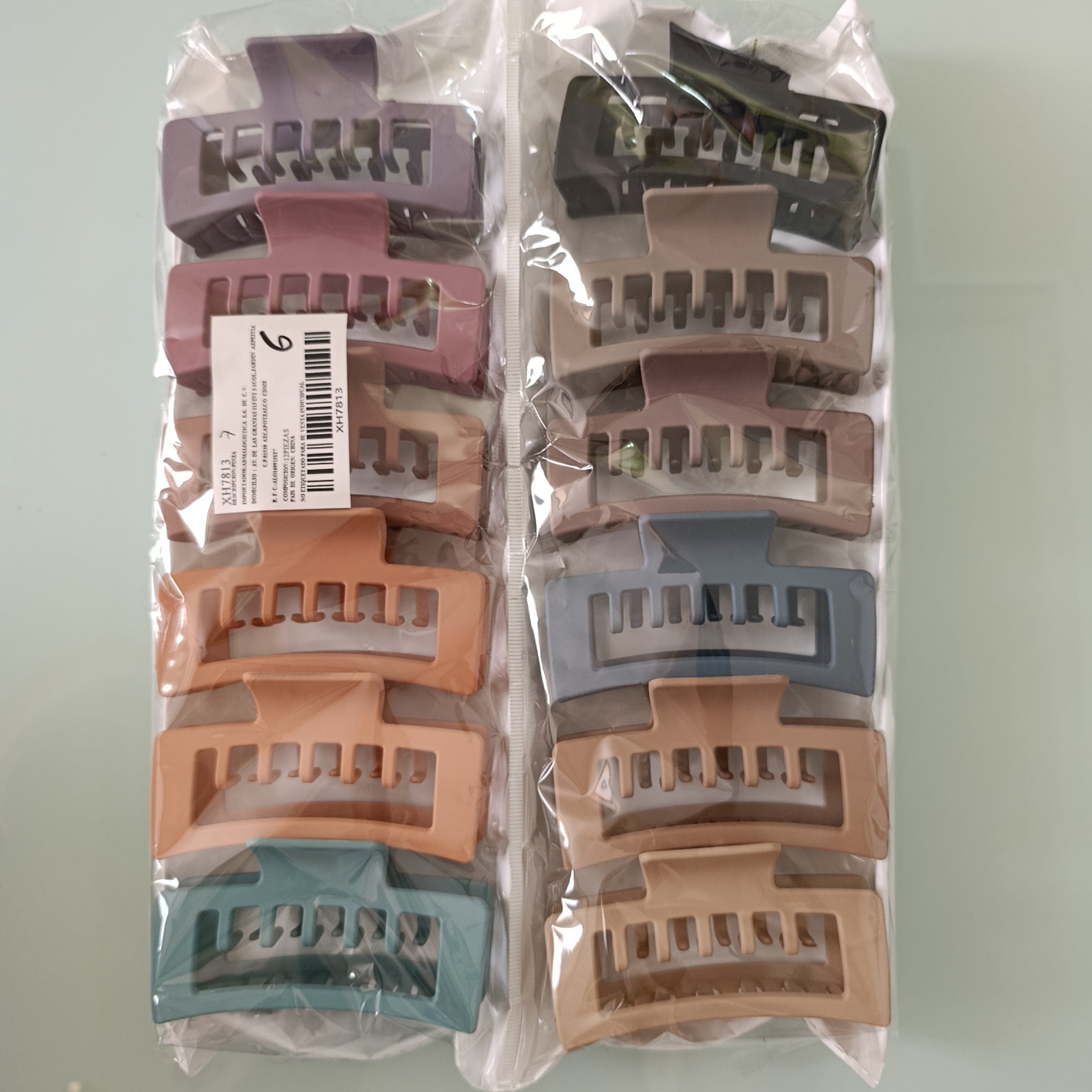 PINZA PARA CABELLO DE PLASTICO RESISTENTE DE 10 CM SURTIDO EN COLORES POR MAYOREO
