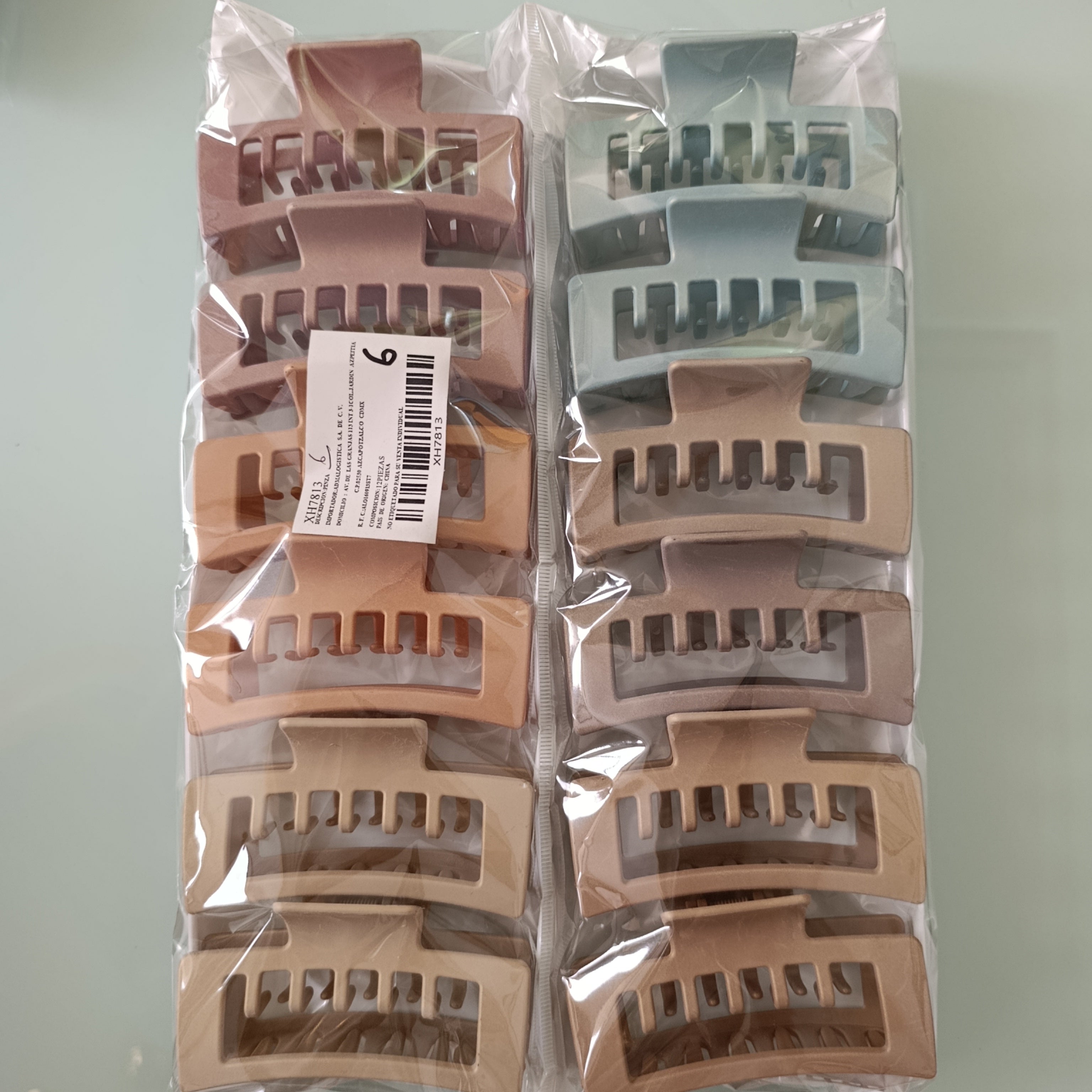 PINZA PARA CABELLO DE PLASTICO RESISTENTE DE 10 CM SURTIDO EN COLORES POR MAYOREO