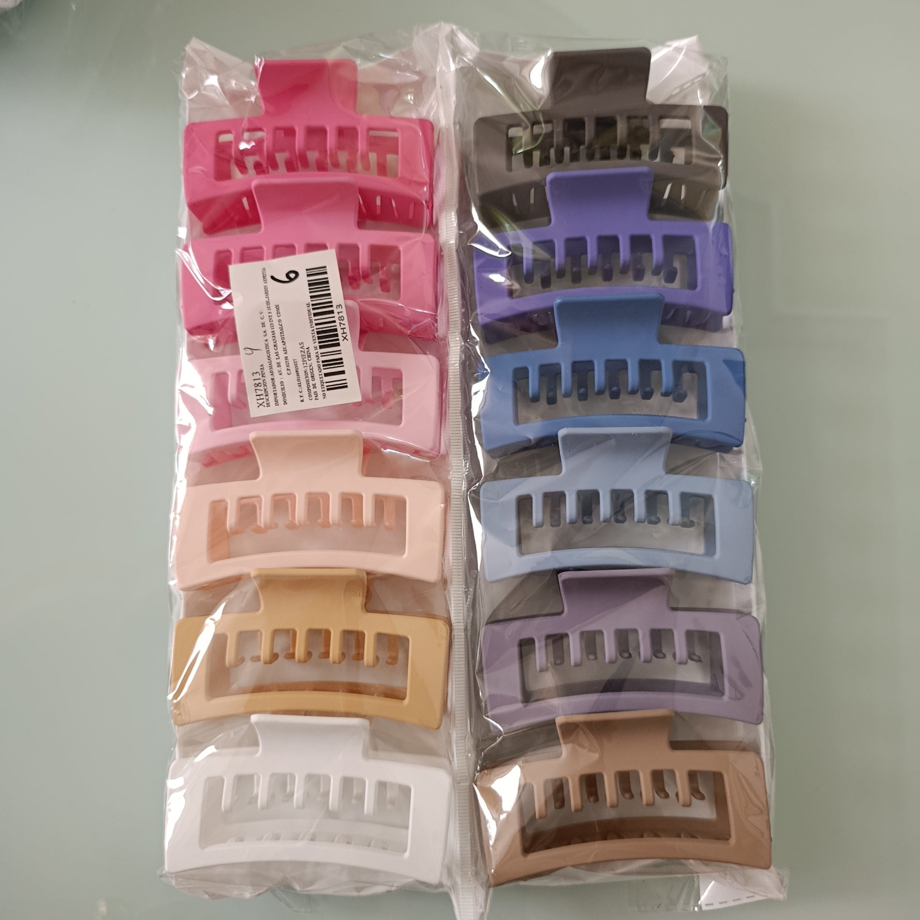 PINZA PARA CABELLO DE PLASTICO RESISTENTE DE 10 CM SURTIDO EN COLORES POR MAYOREO