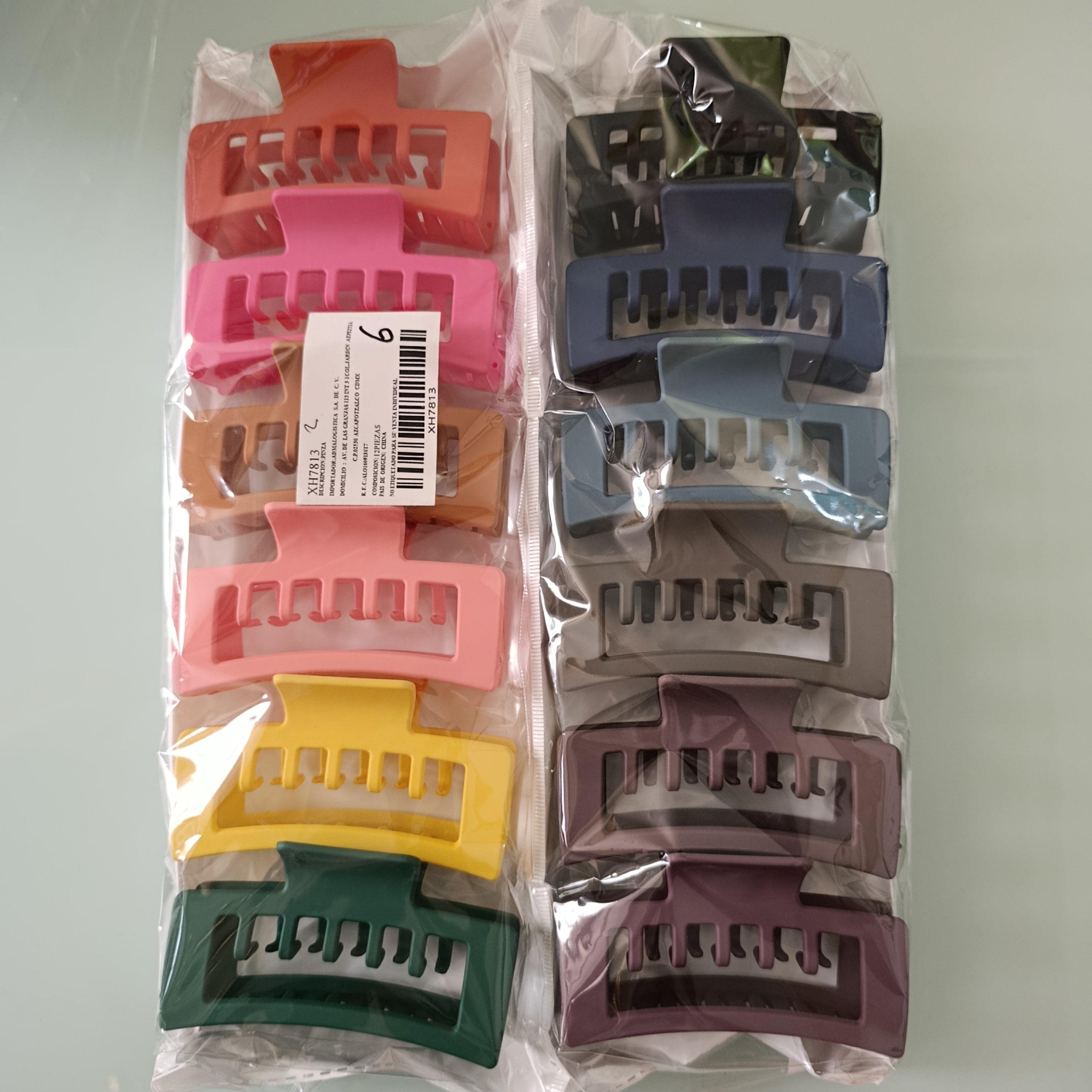 PINZA PARA CABELLO DE PLASTICO RESISTENTE DE 10 CM SURTIDO EN COLORES POR MAYOREO