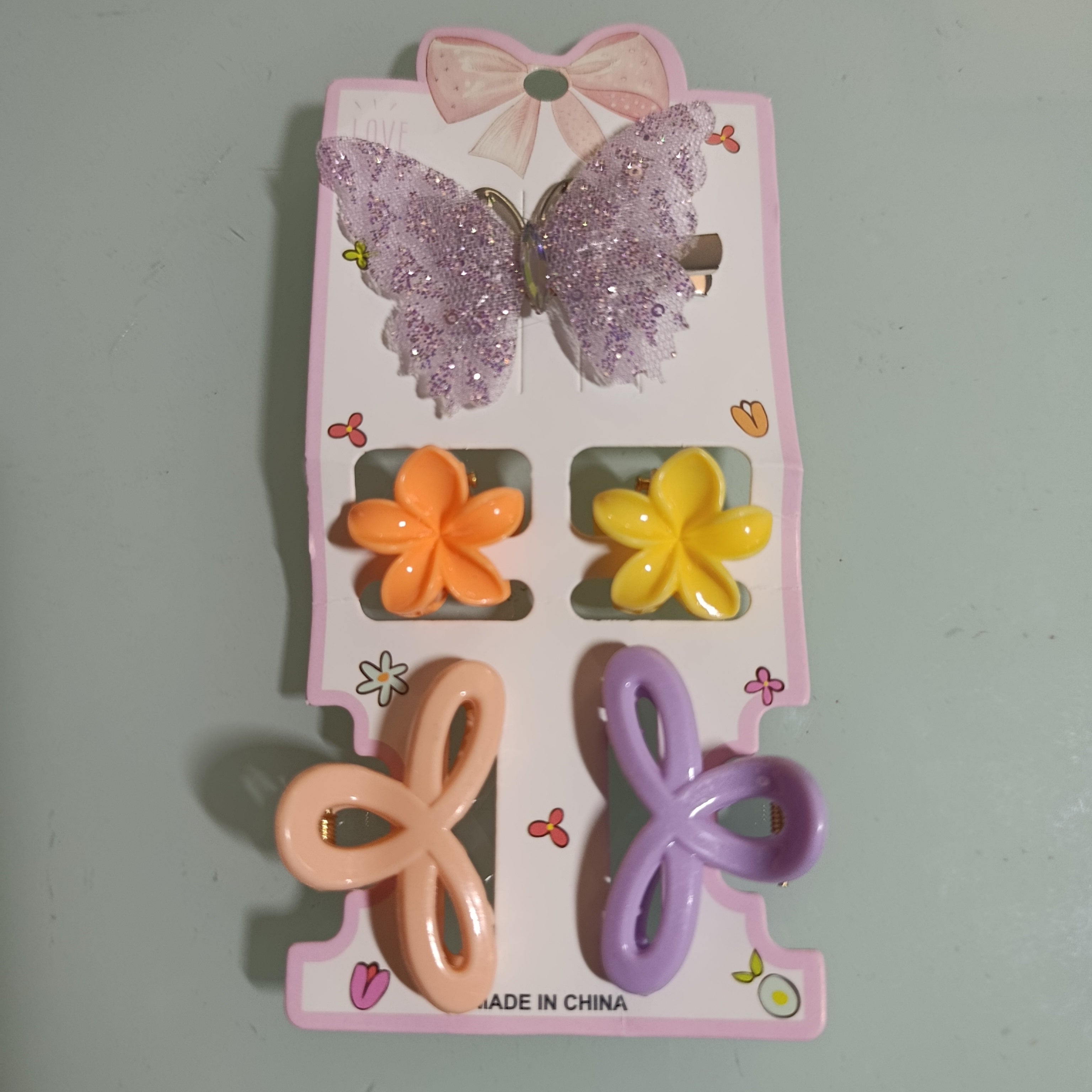 PINZAS PARA CABELLO 5 PIEZAS SURTIDAS EN MARIPOSAS, MOÑOS Y ESTRELLAS DE DIFERENTES COLORES Y MEDIDAS POR MAYOREO