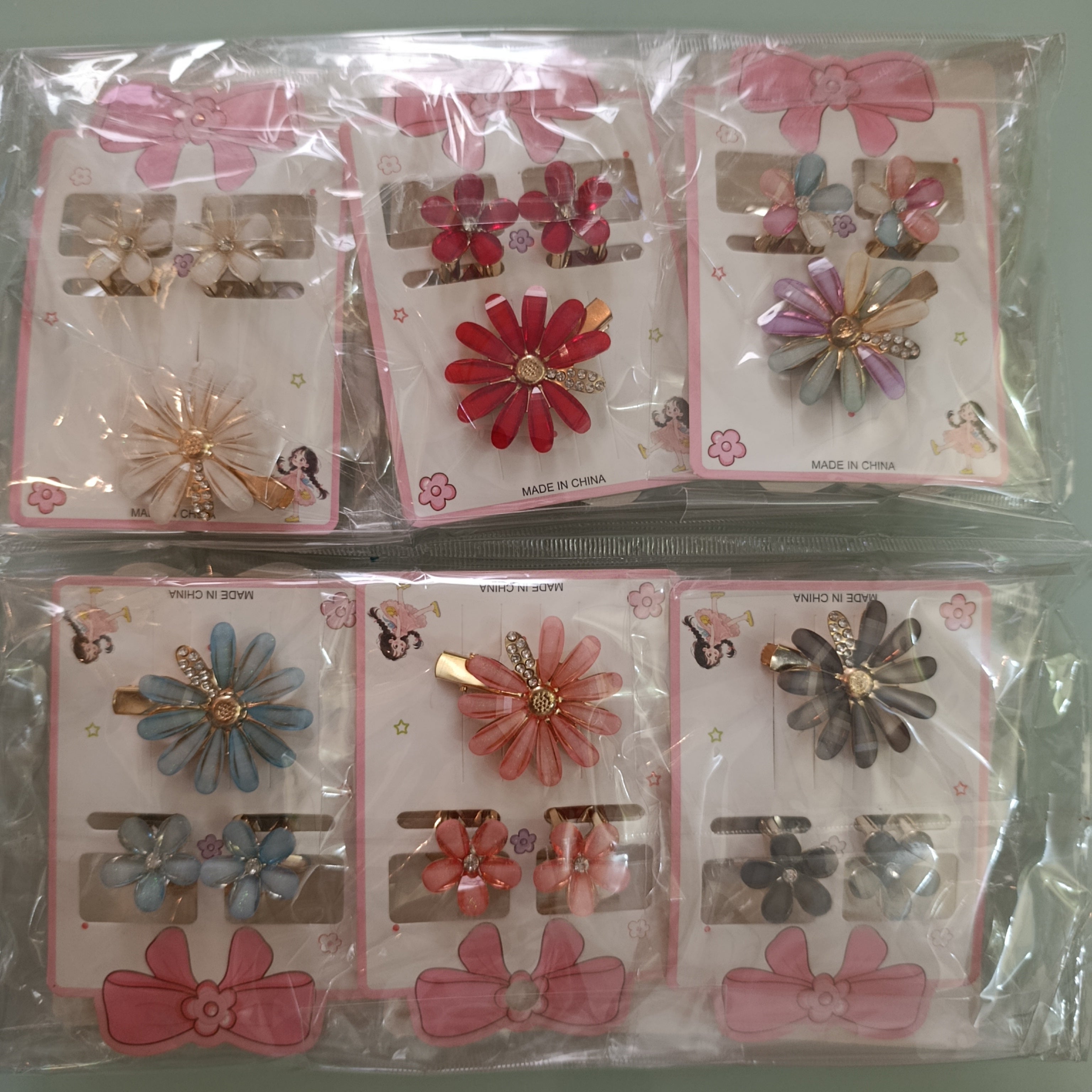 SET DE PINZAS PARA CABELLO CON 3 PIEZAS DISEÑO DE FLORES SURTIDAS EN COLORES POR MAYOREO