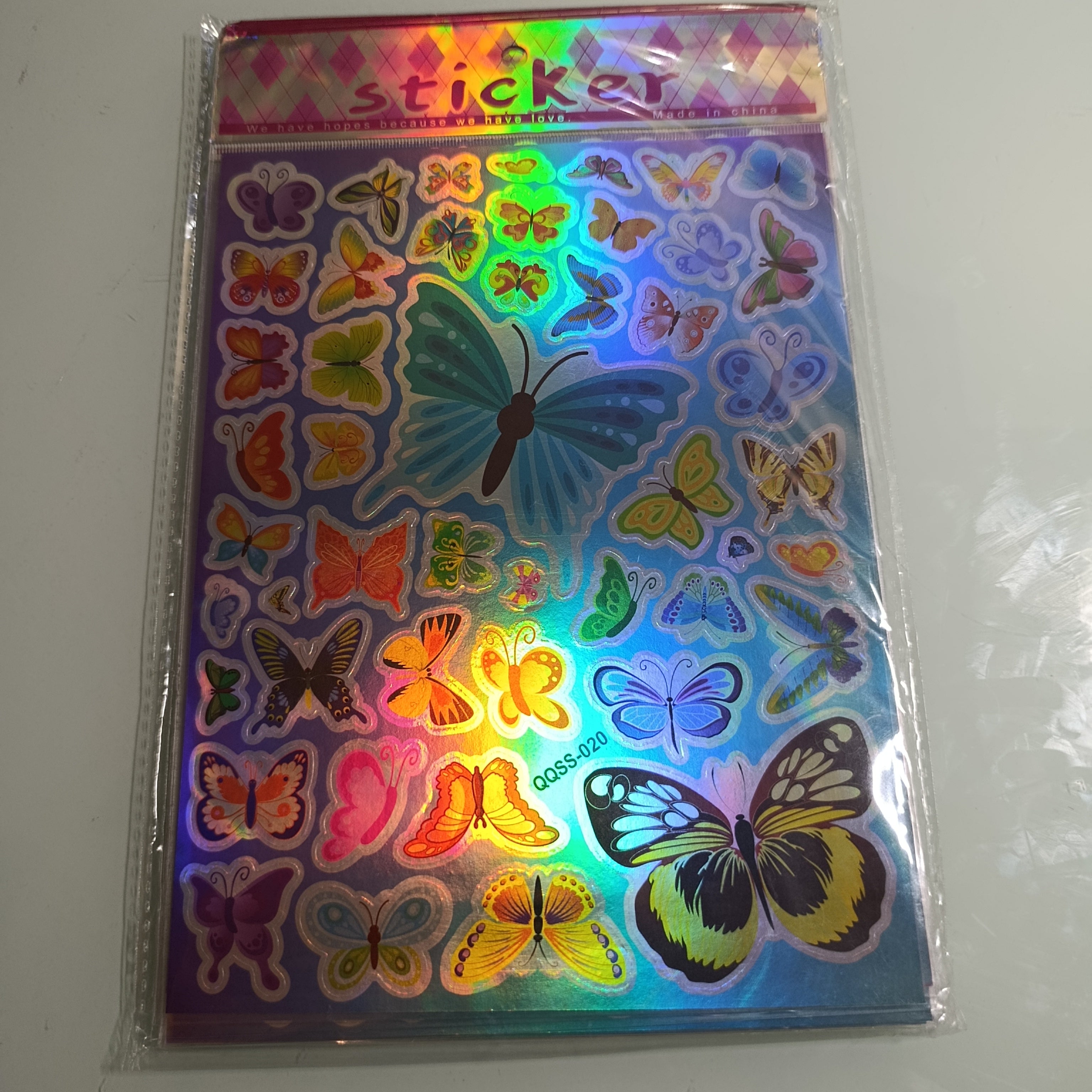 STICKER CALCOMANIA LASER METALICA 28X17.5 CM POR MAYOREO
