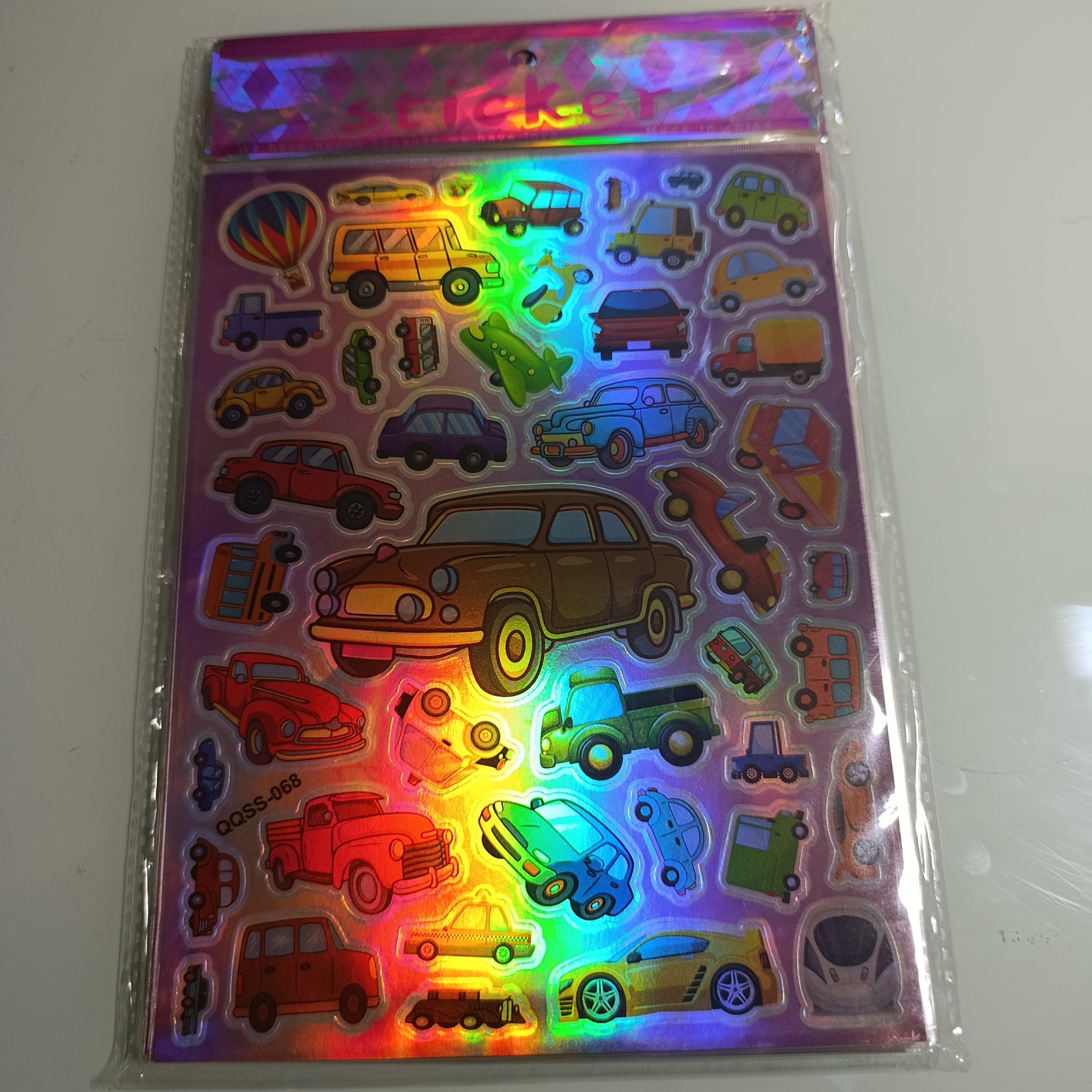 STICKER CALCOMANIA LASER METALICA 28X17.5 CM POR MAYOREO