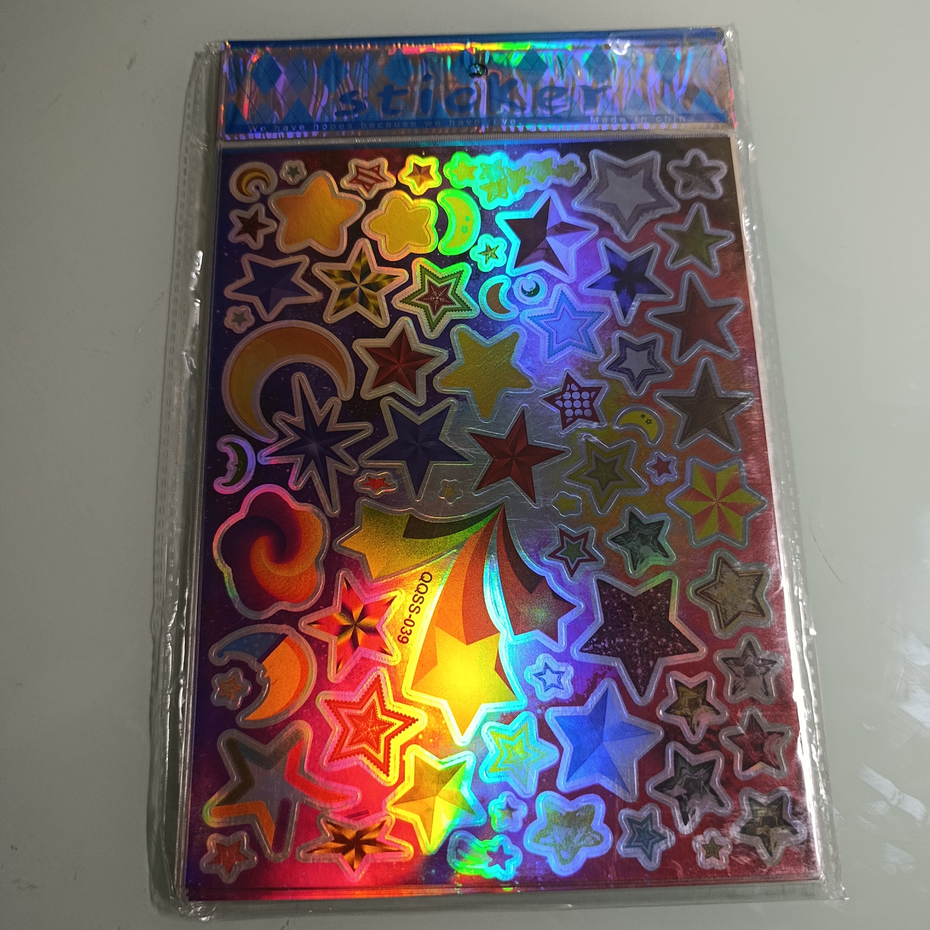 STICKER CALCOMANIA LASER METALICA 28X17.5 CM POR MAYOREO