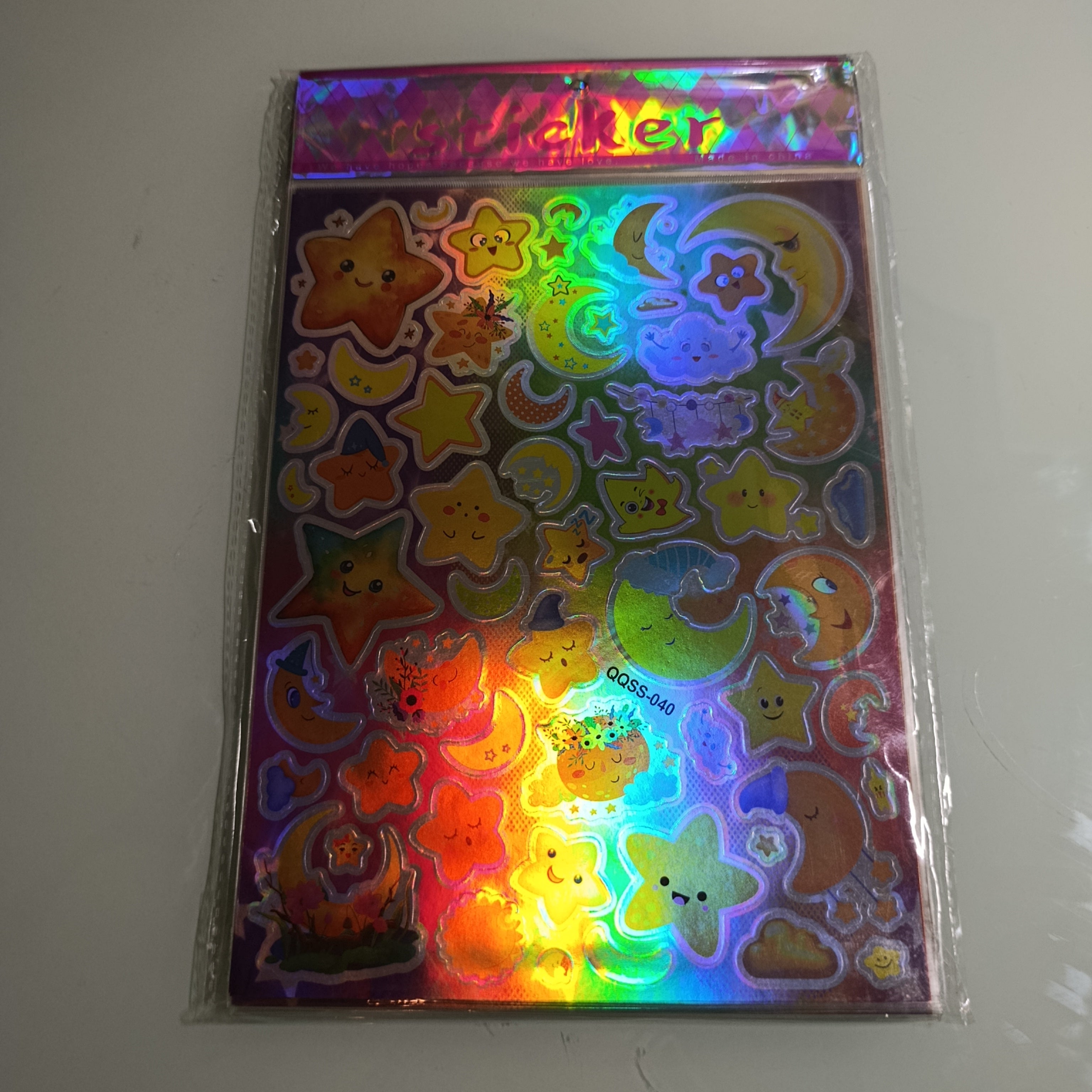 STICKER CALCOMANIA LASER METALICA 28X17.5 CM POR MAYOREO