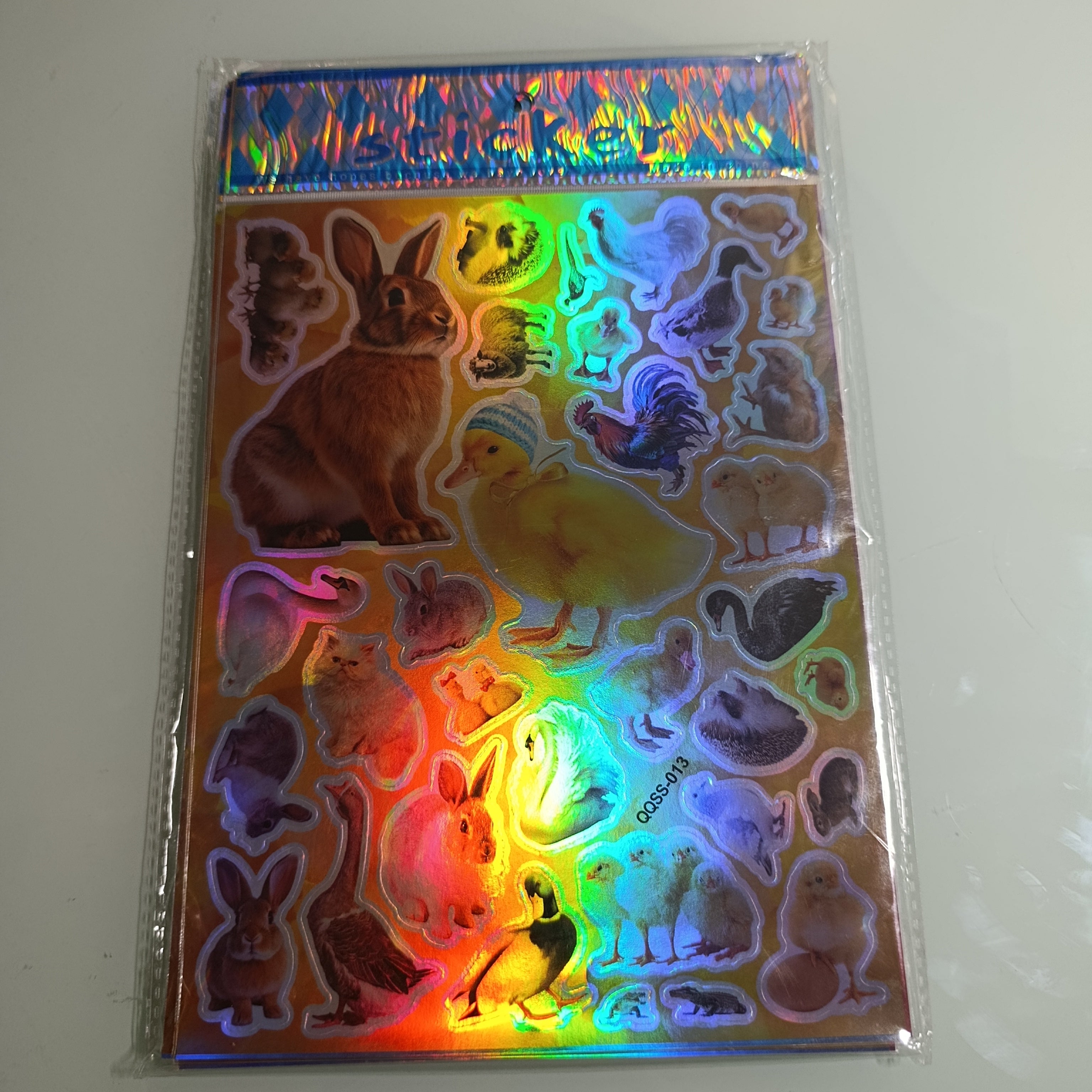 STICKER CALCOMANIA LASER METALICA 28X17.5 CM POR MAYOREO