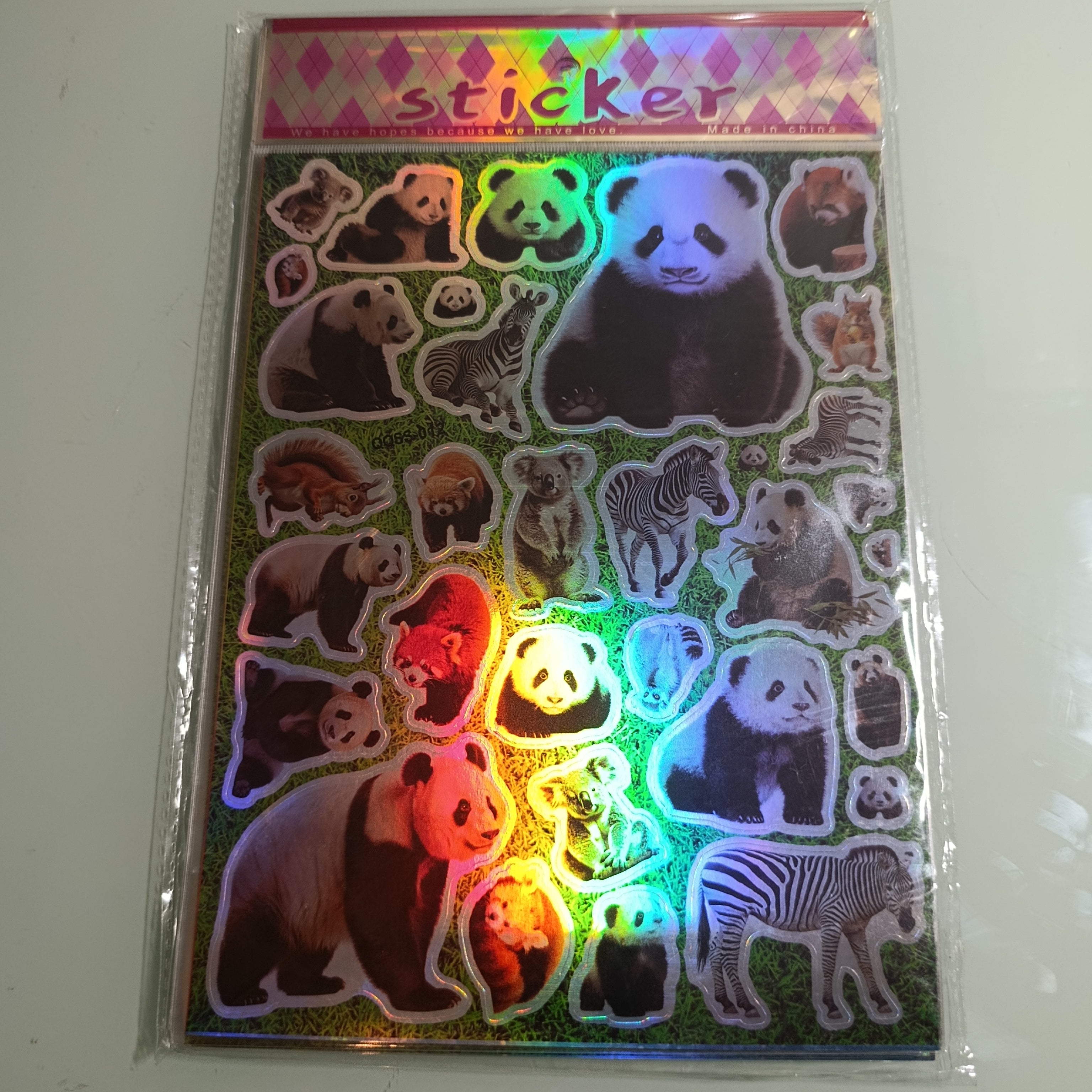 STICKER CALCOMANIA LASER METALICA 28X17.5 CM POR MAYOREO