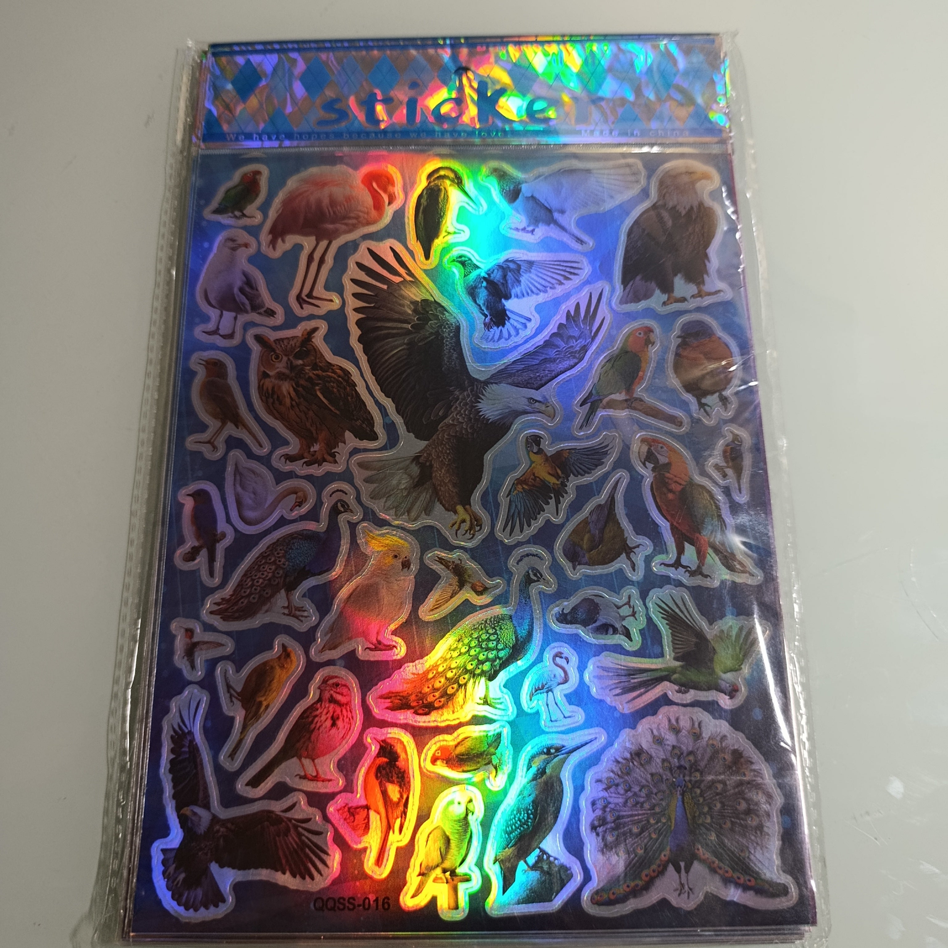 STICKER CALCOMANIA LASER METALICA 28X17.5 CM POR MAYOREO