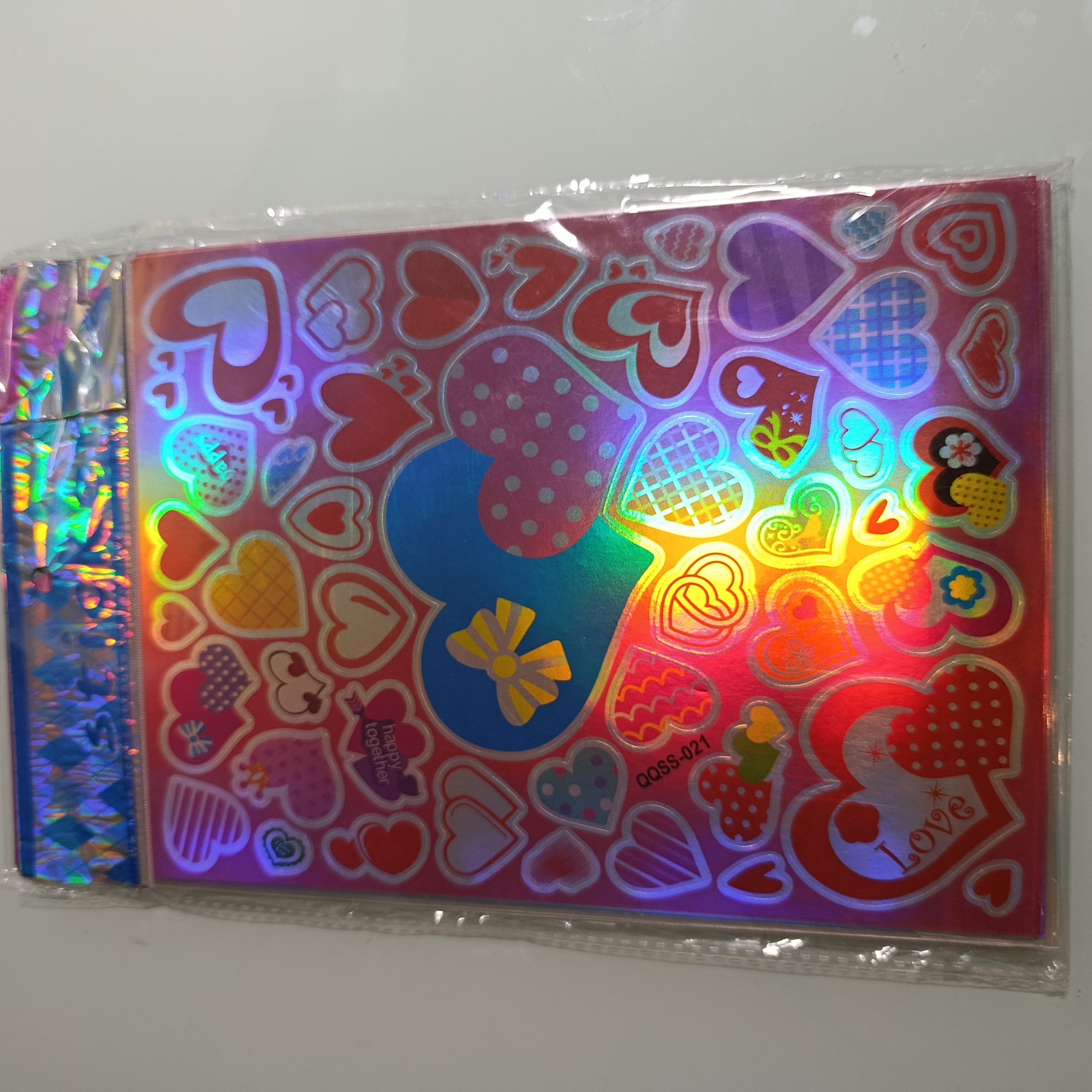 STICKER CALCOMANIA LASER METALICA 28X17.5 CM POR MAYOREO