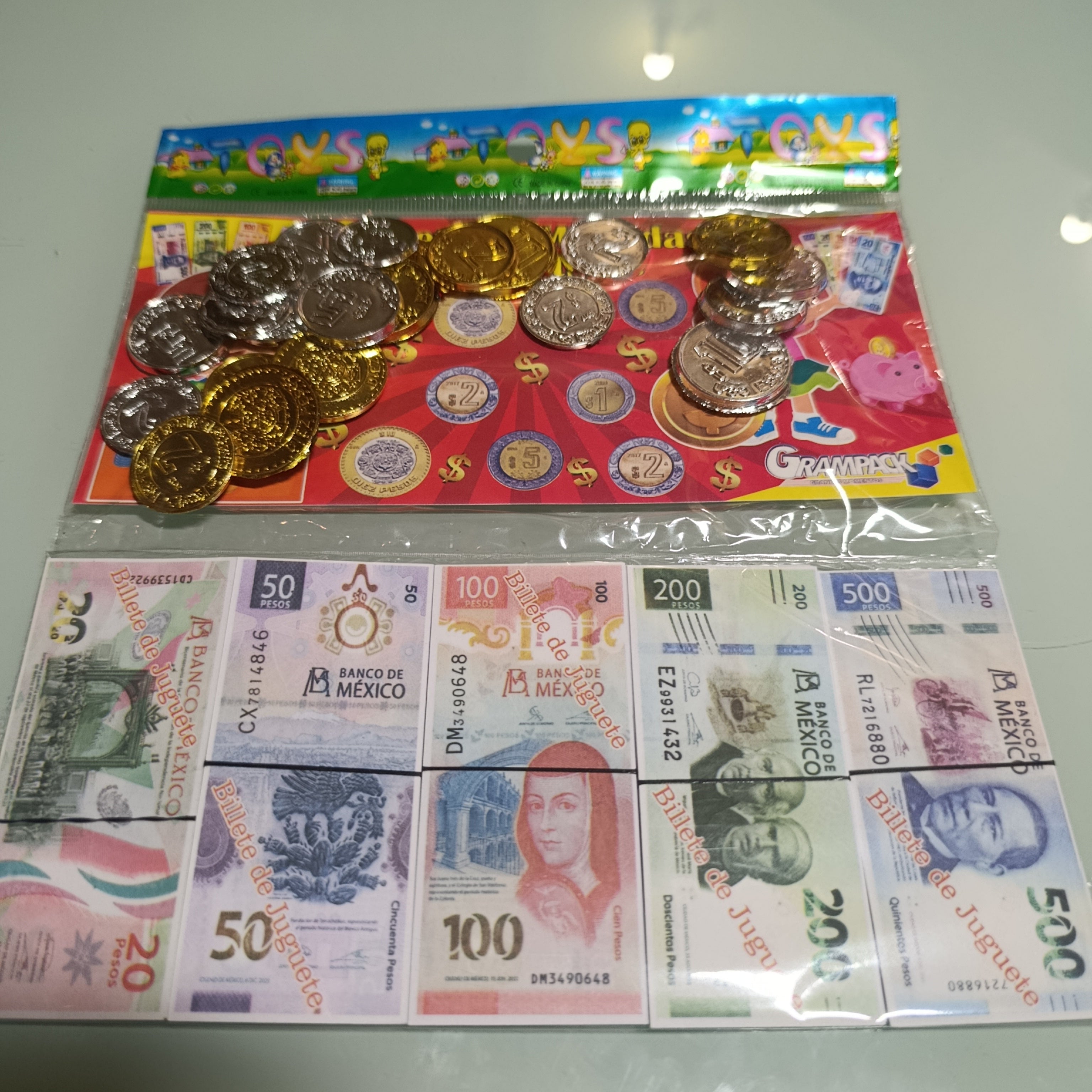 BILLETE EDUCATIVO CHICO 8.5 X 4 CM CON 85 PZAS Y 25 MONEDAS DE DIFERENTES DENOMINACIONES POR MAYOREO